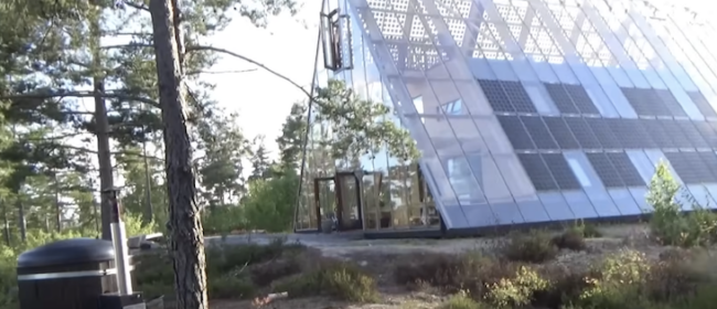 Live where a Greenhouse surrounds the off-grid home